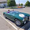 Conclave Day 3 - Rebecca Kemsley sitting in Mike Sanger's Austin Healey 100