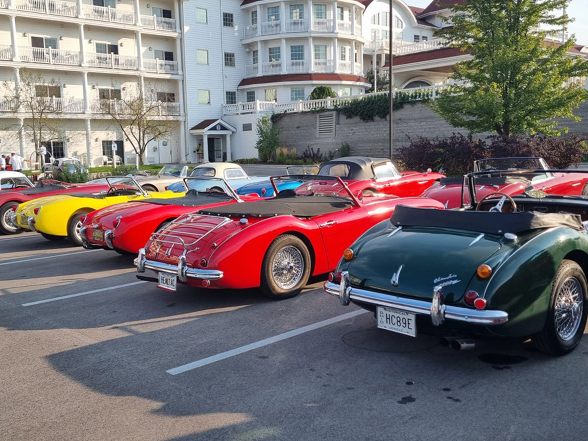 Austin Healeys and Sprite cars parked at Conclave 24 event in the US