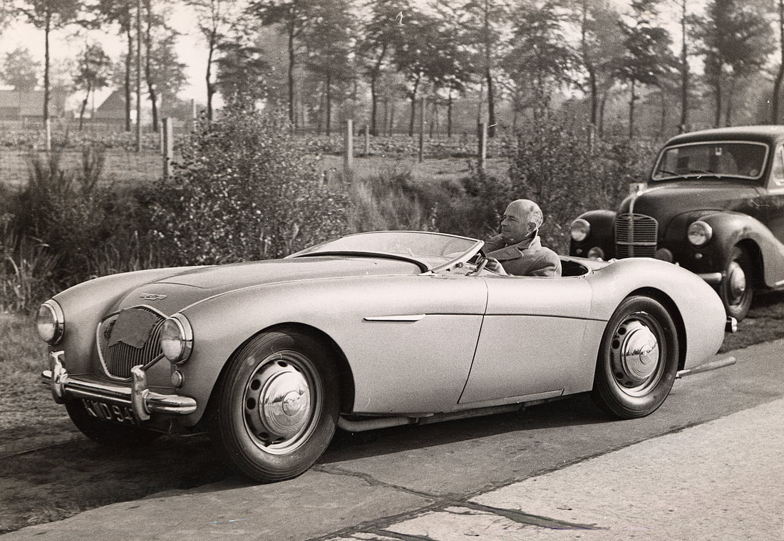 Donald Healey in his Austin Healey 100 at the Belgium race track